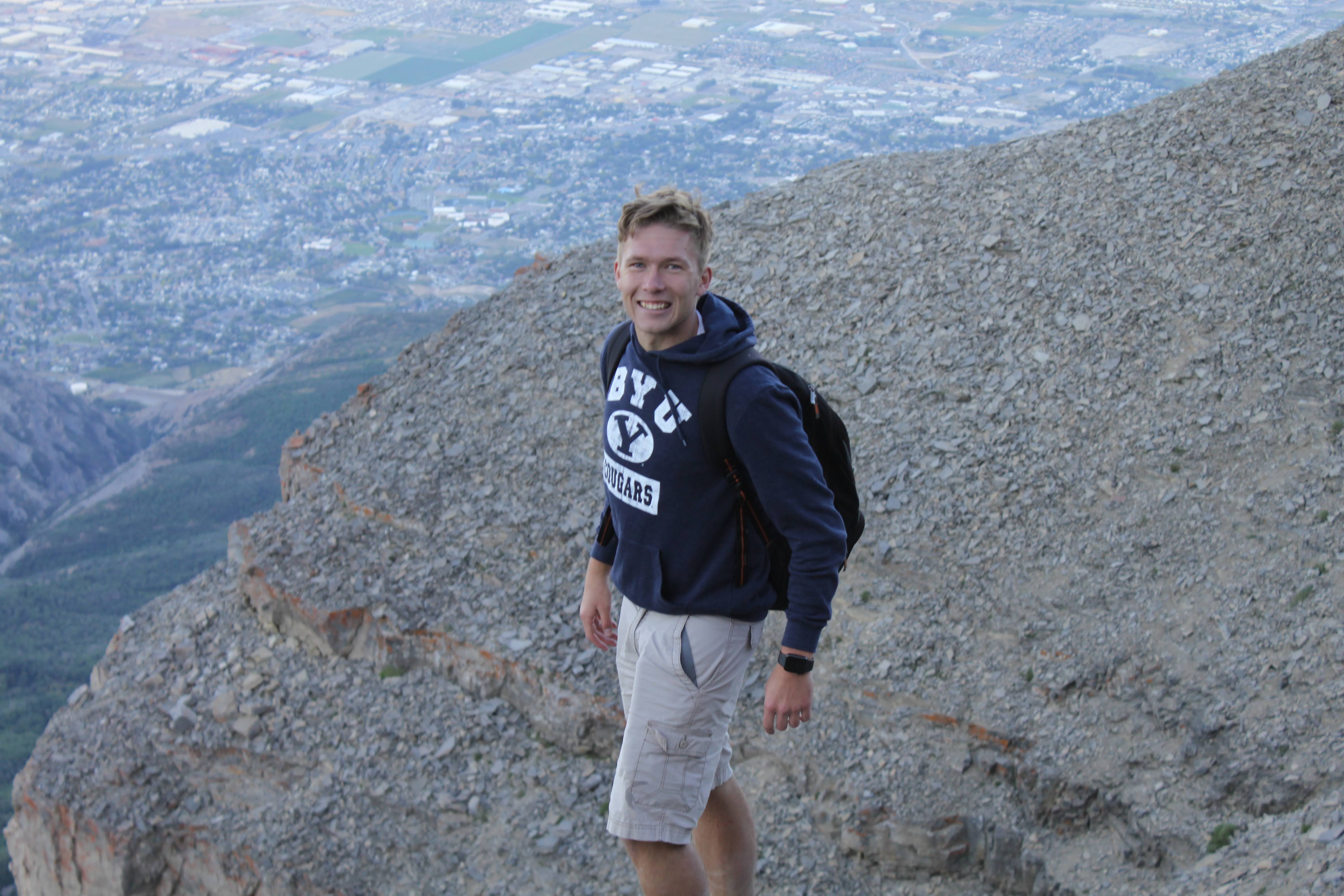 Kamryn looking up at the camera as he hikes the great Mount Timpanogos